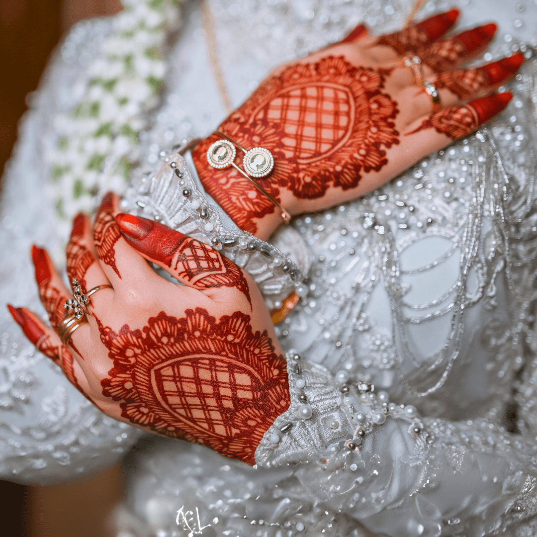 Bridal mehndi — full hand detail with gold bangles