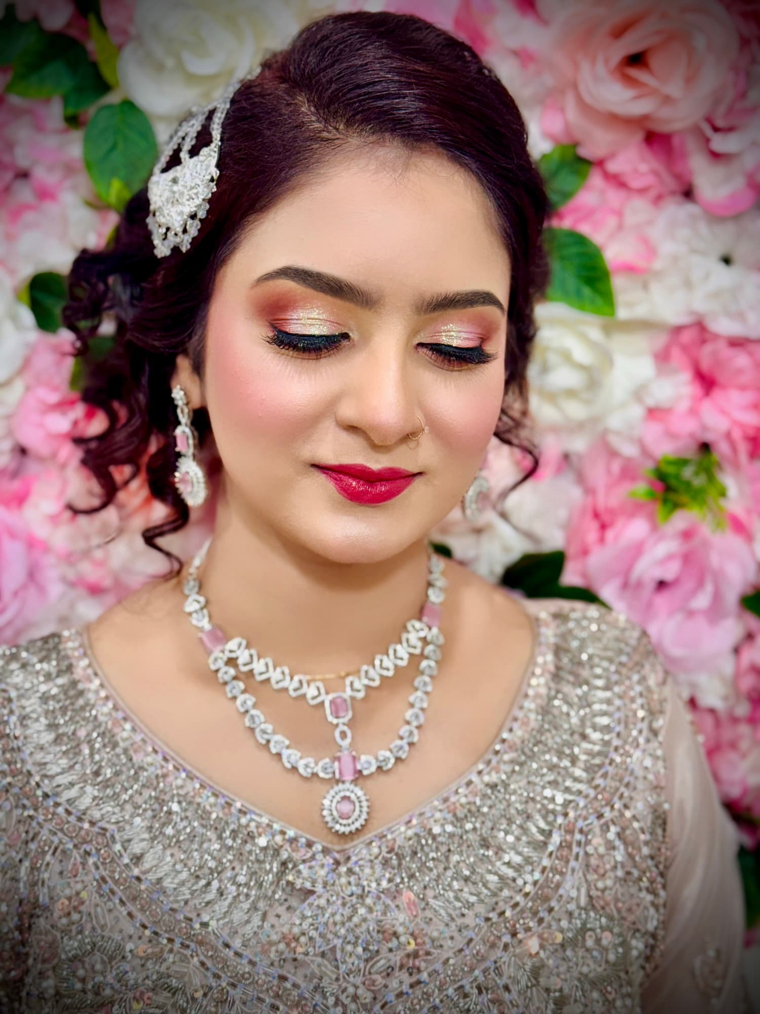 Dewy pink-gold glam with silver headpiece